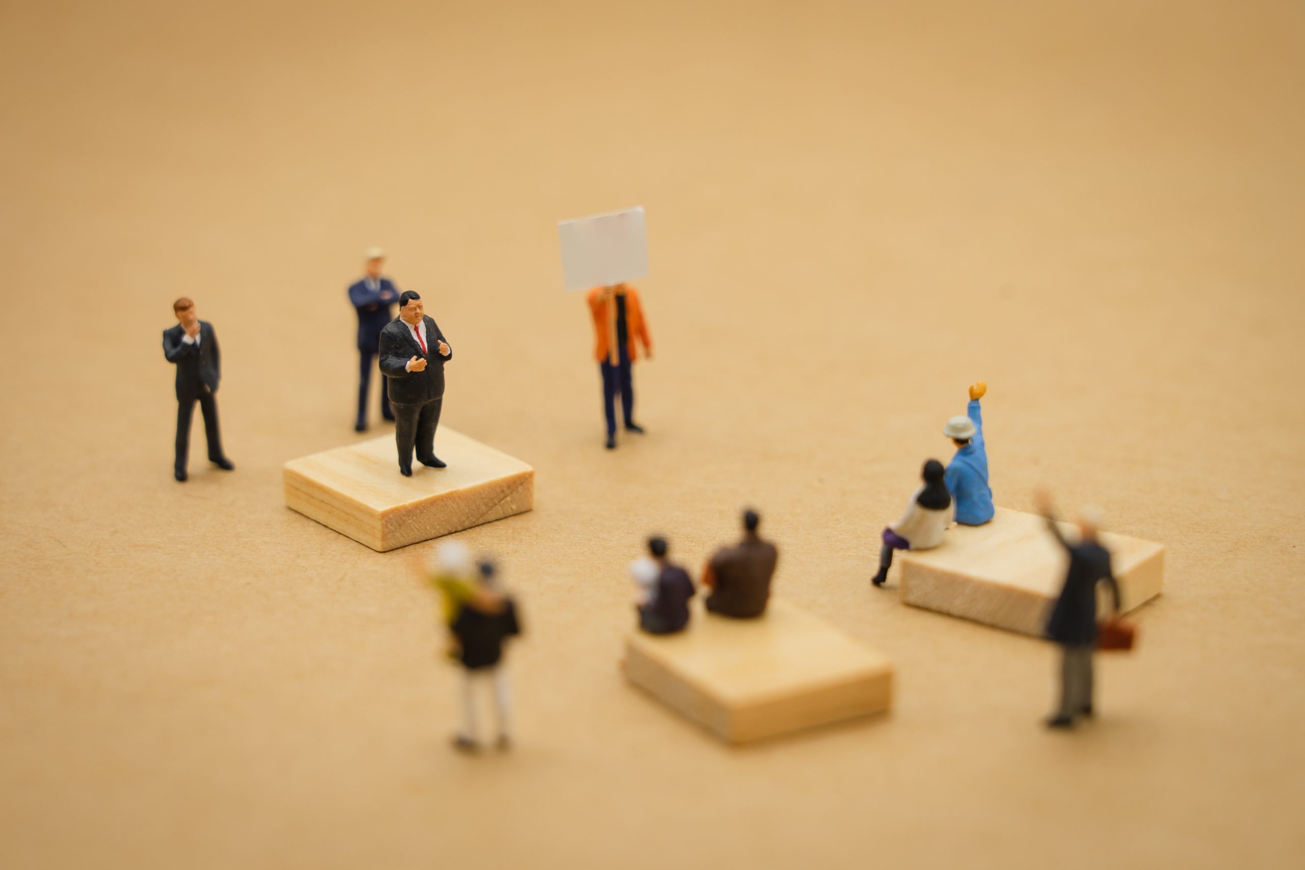 Miniature people businessmen standing Policy statement to conten